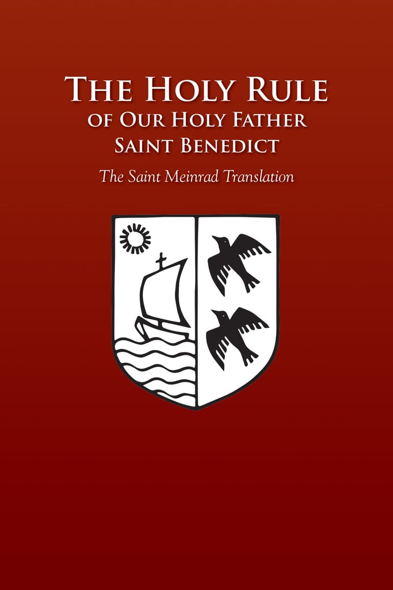 Red book cover with title: The Holy Rule of Our Holy Father Saint Benedict - The Saint Meinrad Translation. Beneath the title is a white and black crest with a drawing of a ship on the sea under the sun in the left portion and two black birds on the right portion.